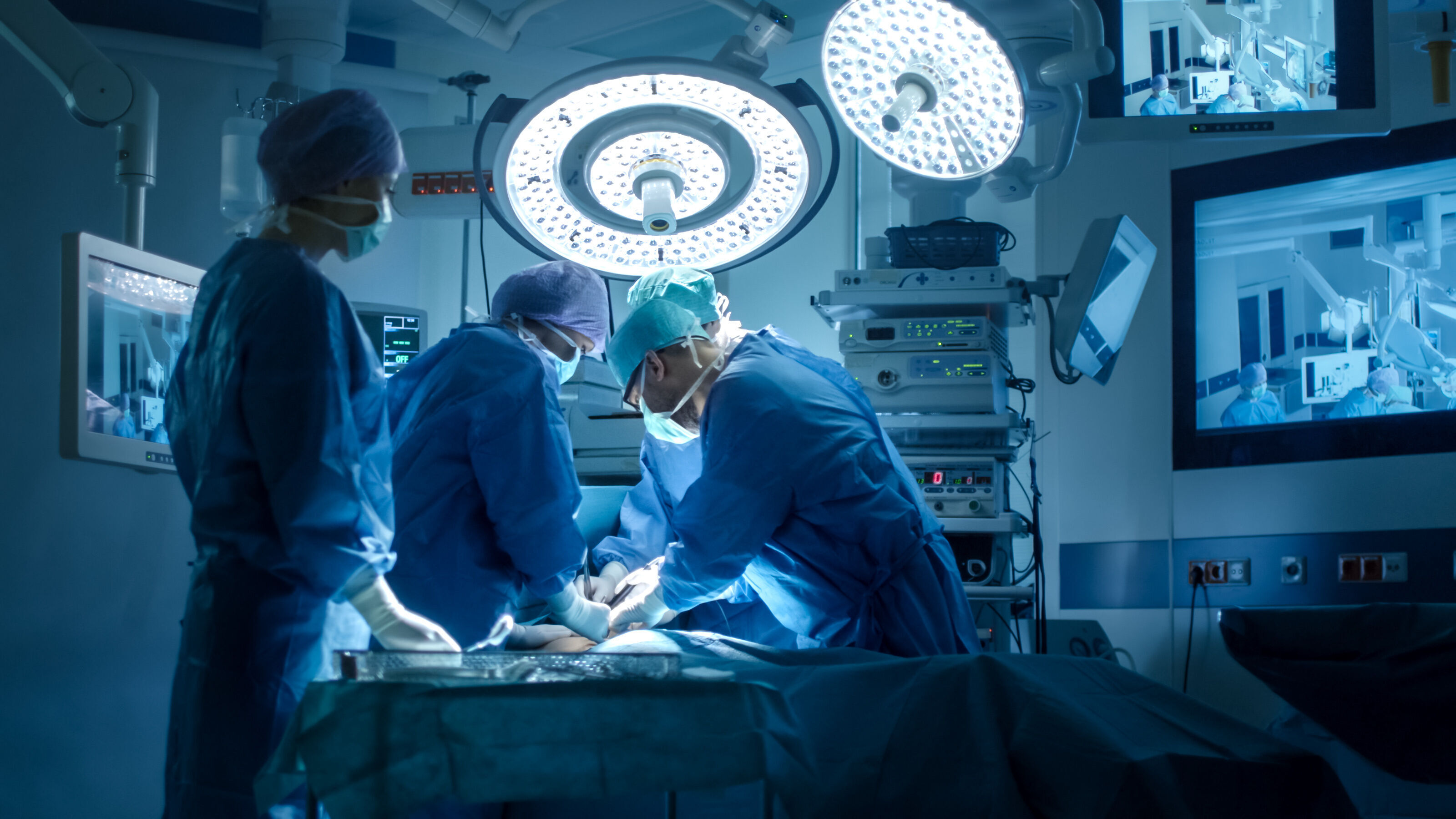 Doctors in operating room.