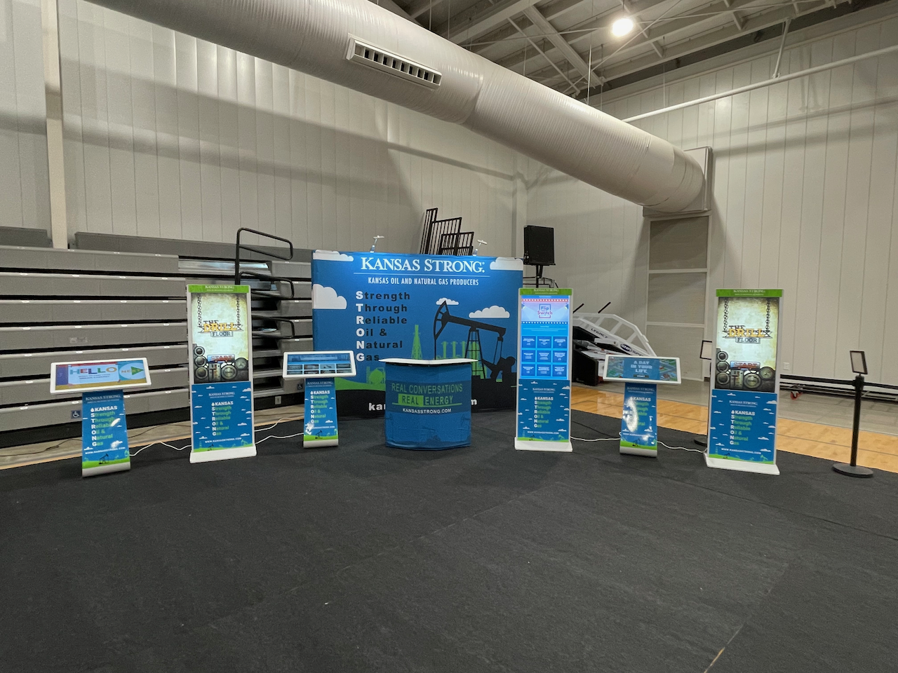 Kiosks and banners displaying Kansas Strong's educational material.